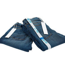 Load image into Gallery viewer, E-commerce return security tag on jeans. Prevent return fraud like wardrobing, wear and return, counterfeit product switches and tag switches. Add return tag to clothing, shoes, accessories to stop fraudulent returns. 360 ID Tag.