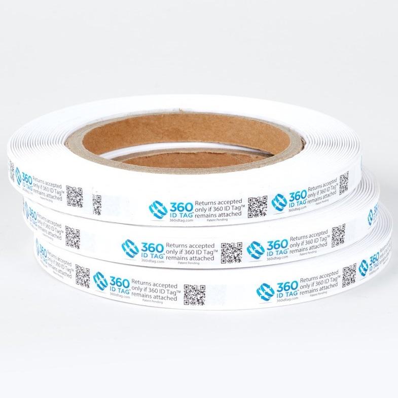 Stack of e-commerce anti-return fraud tags on rolls. 360 ID Tag