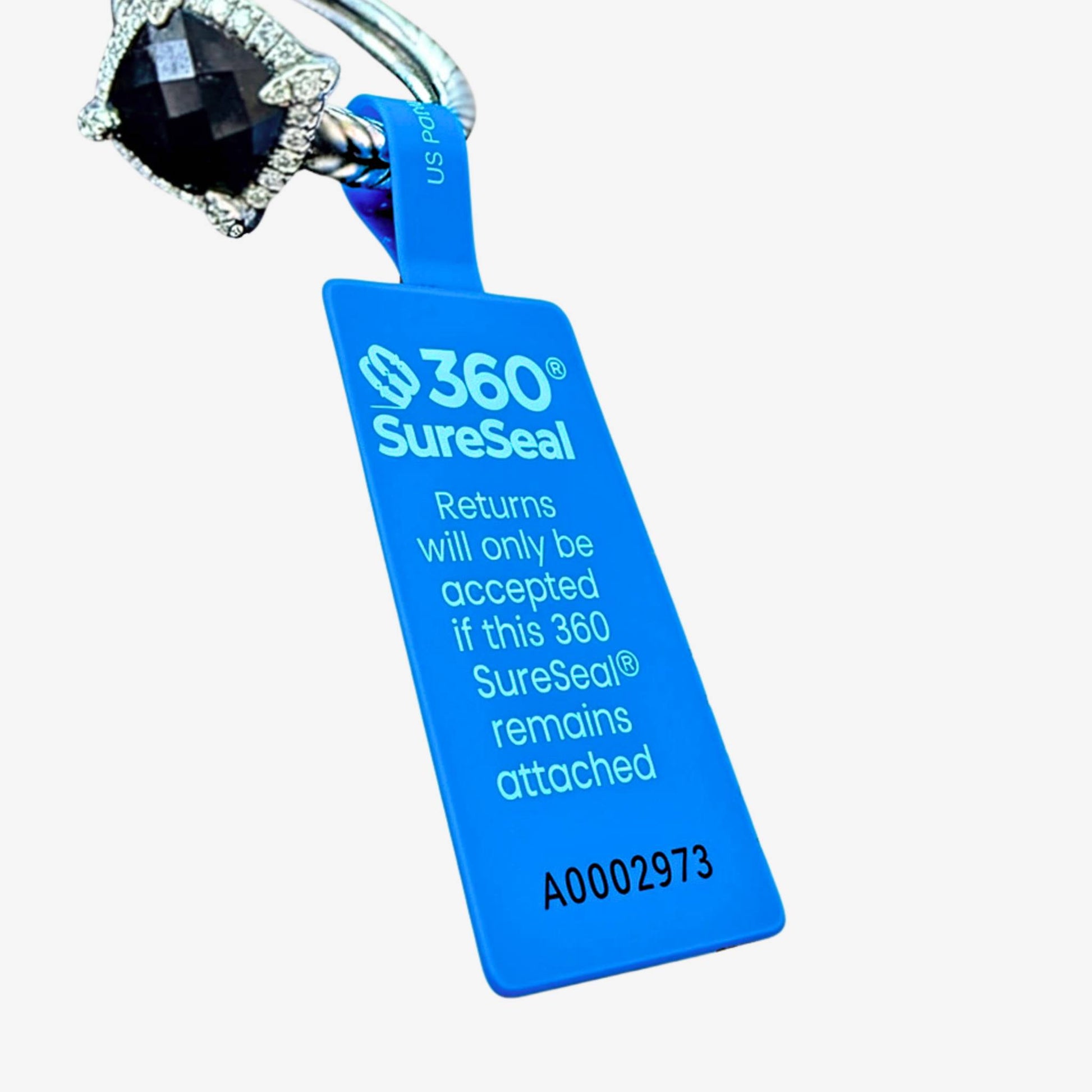 360 SureSeal small tamper-evident return integrity tag attached to jewelry ring for e-commerce return fraud prevention