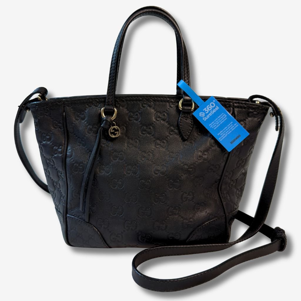 Tamper-evident return integrity seal 360 SureSeal security tag applied to handbag strap to prevent return fraud and product switching