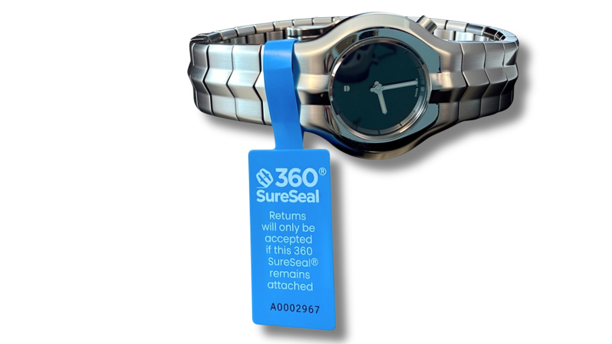 Return integrity tag shown on jewelry watch. Tamper evident. 360 SureSeal