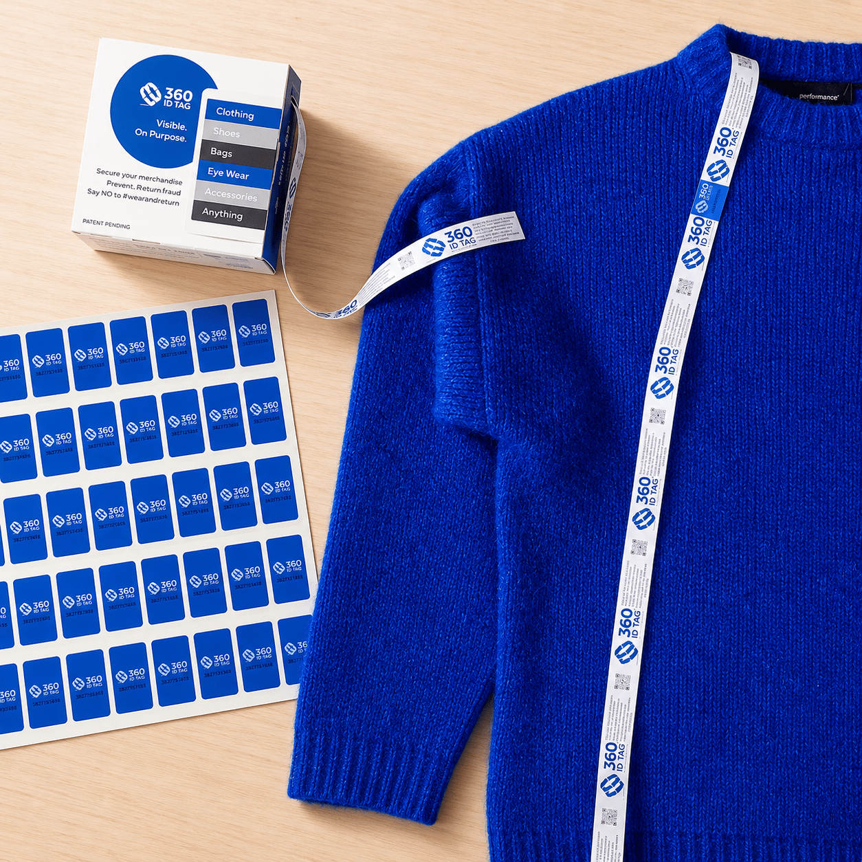E-commerce return security tag on sweater. Prevent return fraud like wardrobing, wear and return, counterfeit product switches and tag switches. Add return integrity tag to stop fraudulent returns. 360 ID Tag.