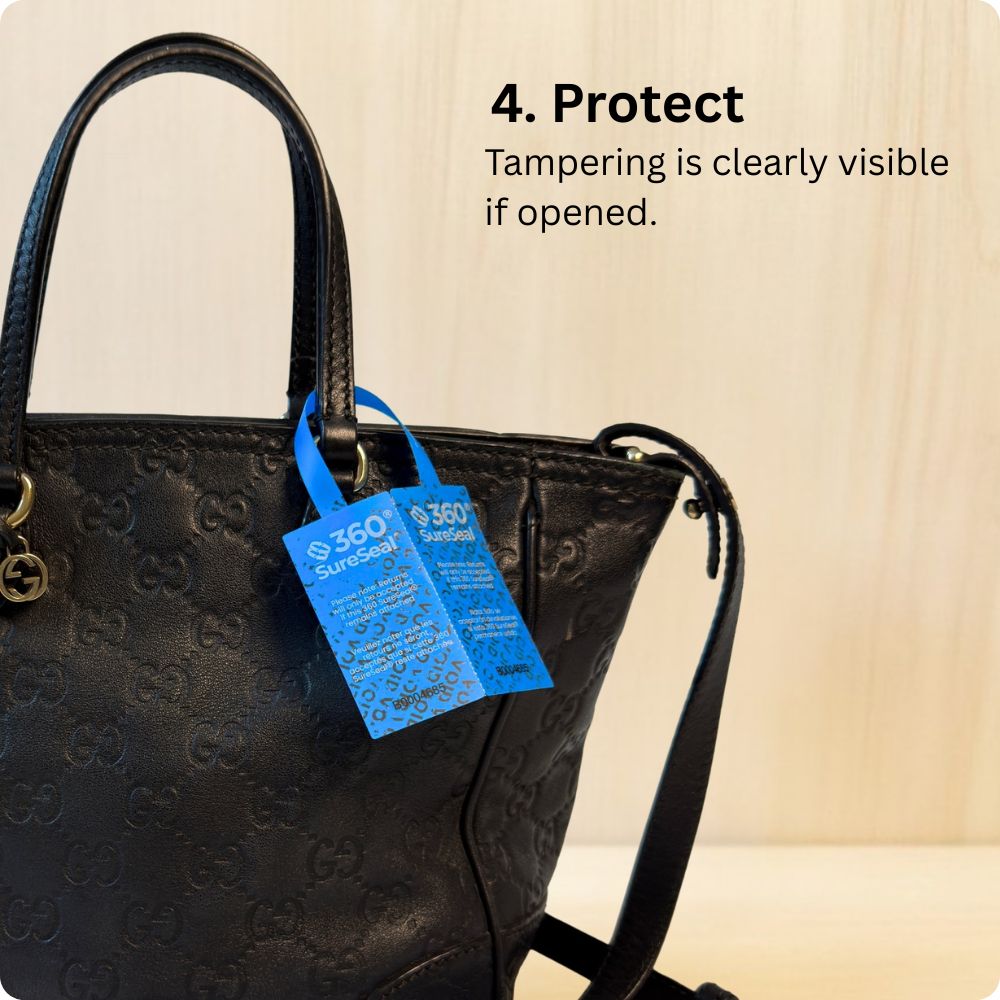 Attaching a 360 SureSeal Large to a handbag to stop e-commerce return fraud. Return integrity tag.