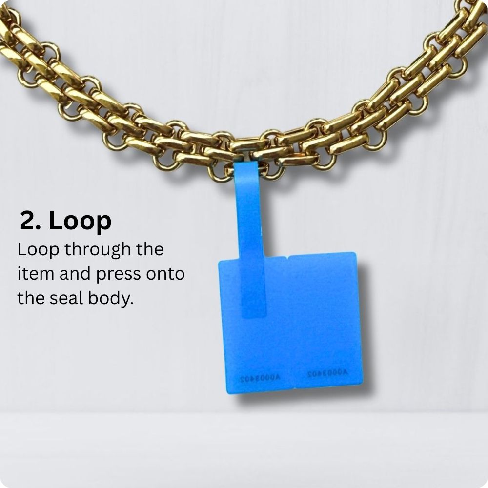 Attaching a 360 SureSeal Small to jewelry accessory to stop e-commerce return fraud. Return integrity tag.