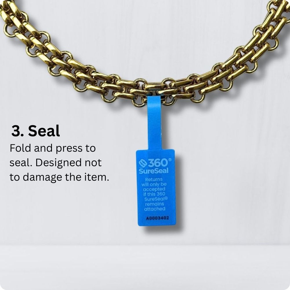 Attaching a 360 SureSeal Small to jewelry accessory to stop e-commerce return fraud. Return integrity tag.