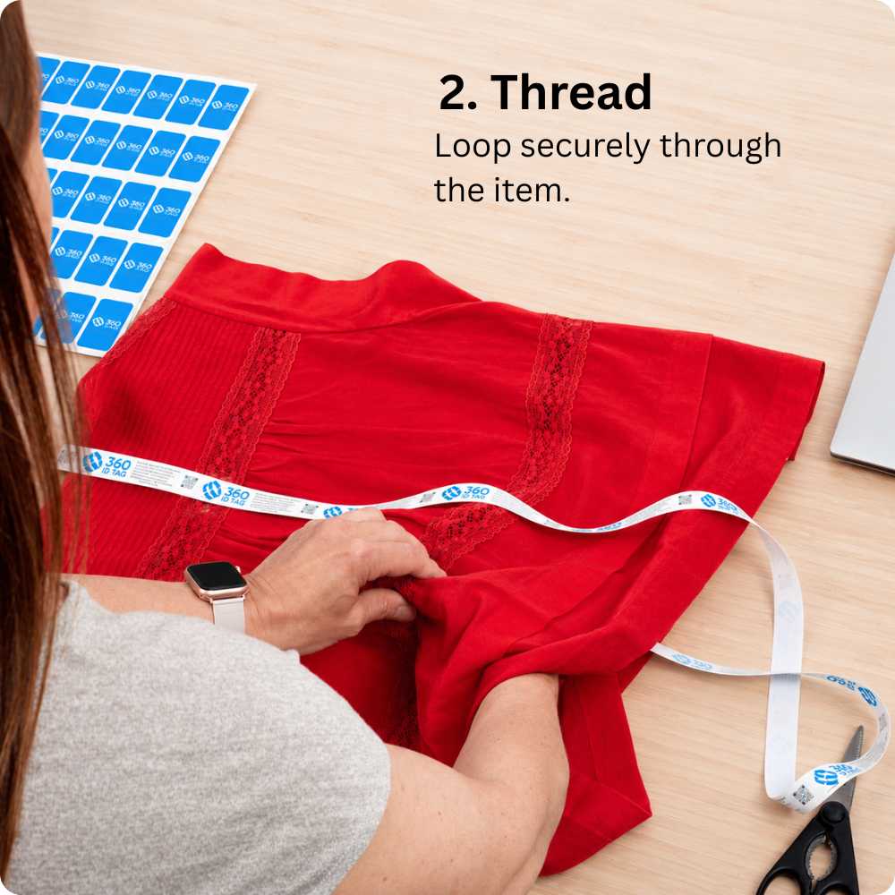 Attaching a 360 ID Tag to a blouse to stop e-commerce return fraud. Return integrity tag.
