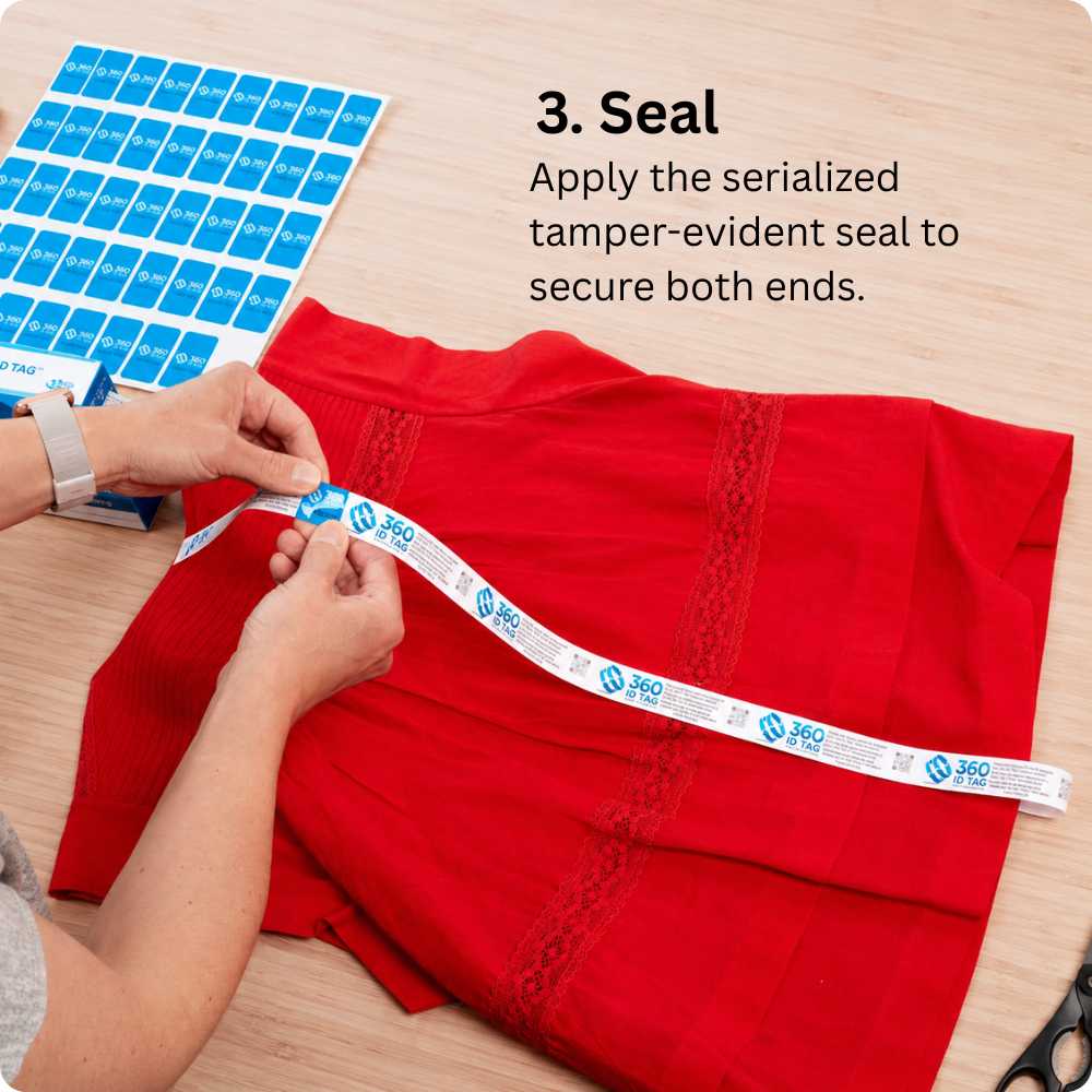 Attaching a 360 ID Tag to a blouse to stop e-commerce return fraud. Return integrity tag.